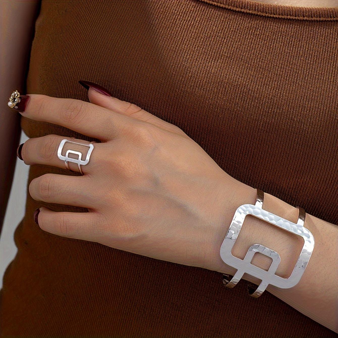 

A Set Of Sweet And Charming Thick Large Iron Ring In Golden, Black, And Silvery Geometric Design