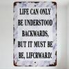 Vintage Rustic Metal Sign Life Can Only Be Understood Backwards Motivational Wall Plaque with Weathered Edge for Home Office Dec