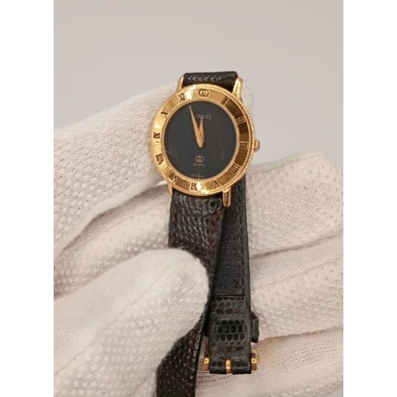 Used GUCCI Gucci watch ladies quartz black dial gold bezel