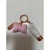 Used d'Alba UV Essence Keychain Charm, Pouch