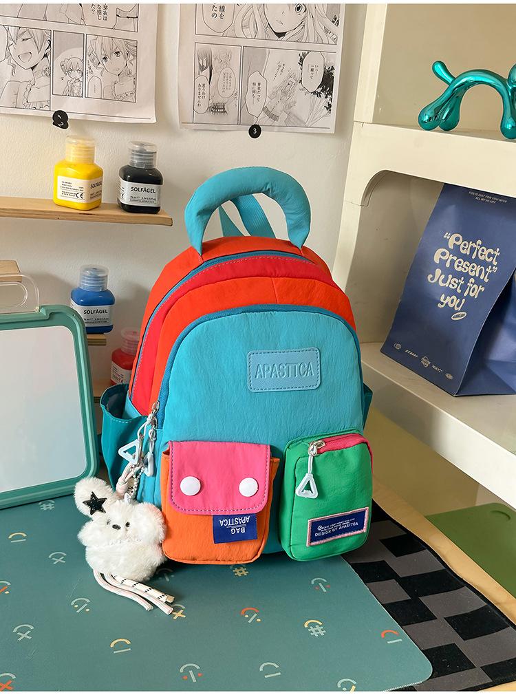 Schoolbag vitality rainbow color matching splicing backpack girl childlike dopamine wind shopping photo clock in backpack