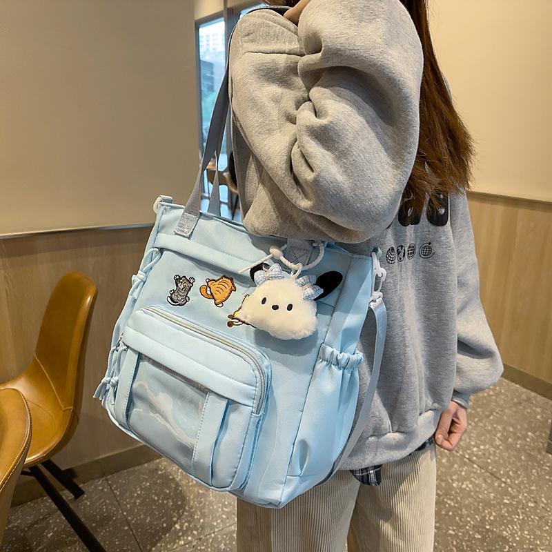 Cute messenger bag women's 2025 new Japanese pain bag large-capacity shoulder bag girl junior high school student portable tote bag