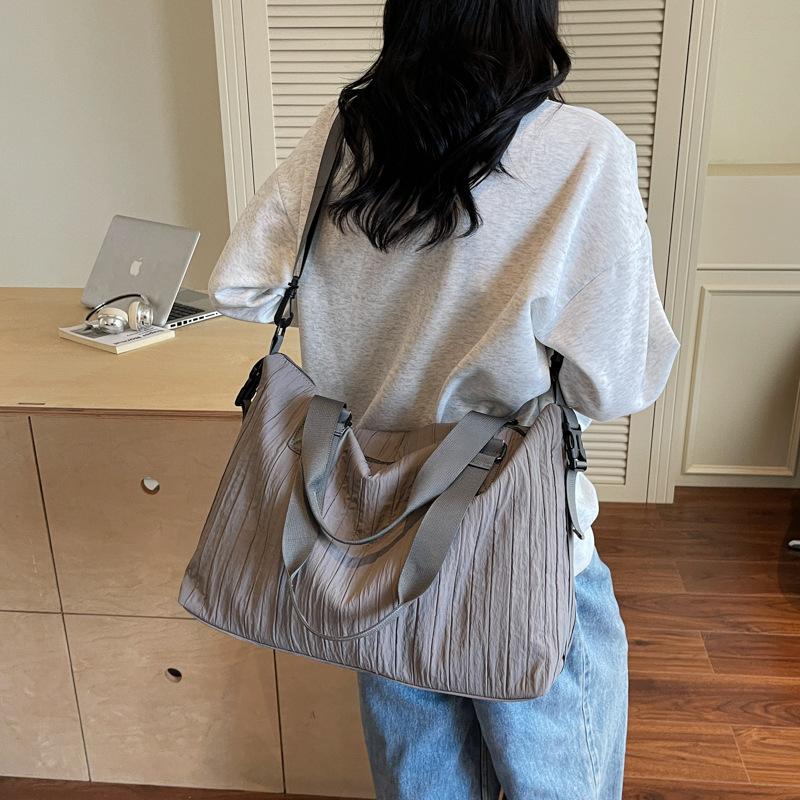 Niche large-capacity canvas bag women's new commuter messenger bag shopping class shoulder tote bag