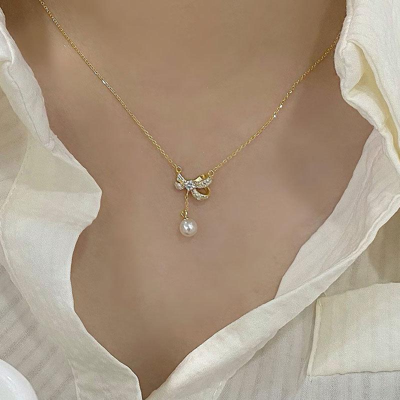 Collier de perles à nœud papillon, design de niche doux, chaîne de clavicule sensée, collier de super fée de tempérament