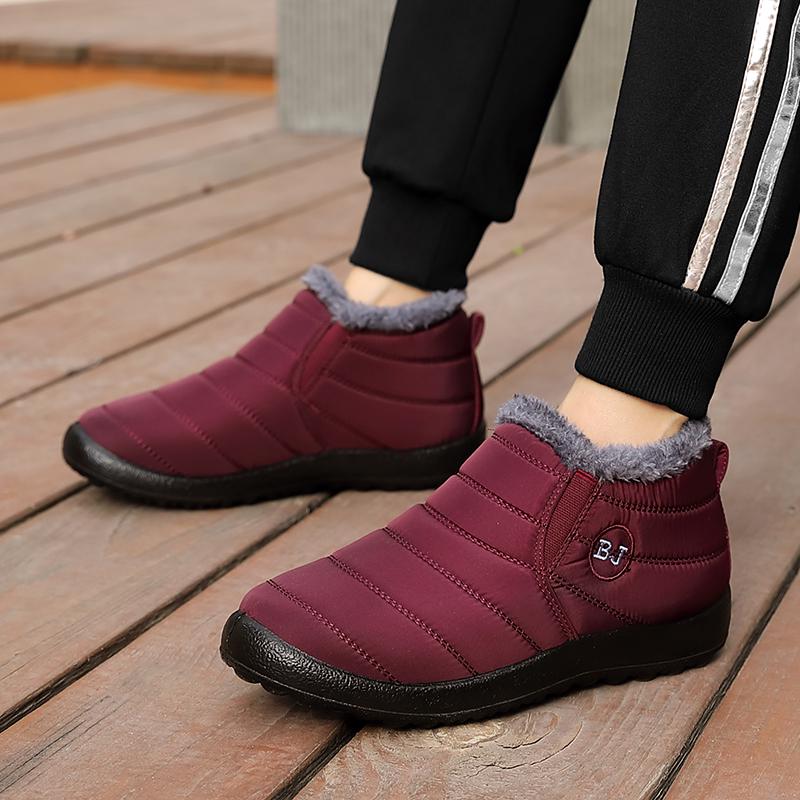 Botas de invierno para hombre/mujer que mantienen las botas de nieve abrigadas