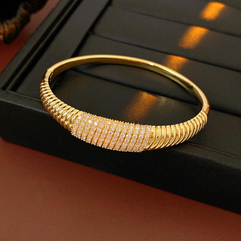 Elegant Striped Oval Bangle Bracelet With Gold Plating For Fashionable Women