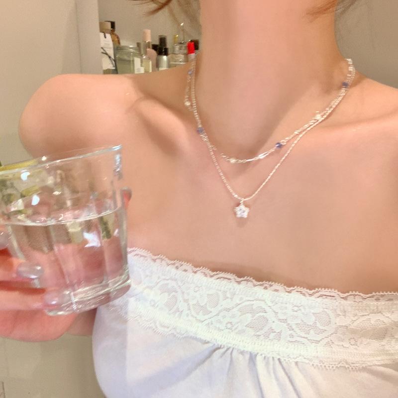 French glass beaded star zircon pendant, double-layer pearl necklace, light luxury high-end collarbone chain, versatile neck chain.
