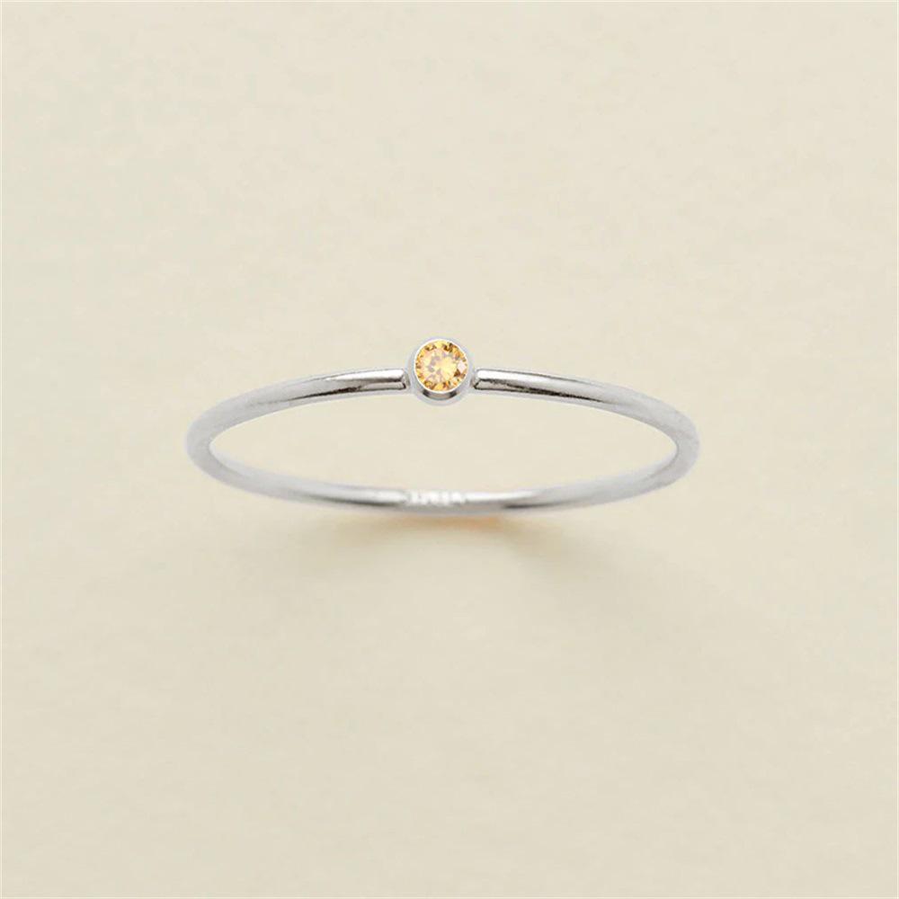 eManco Gold-Plated Non-Constricting Ring for Women - Thin Band with Tiny Diamond Accents and December Birthstone