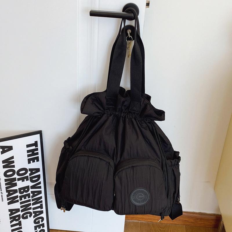 Niche design backpack women's new leisure travel lightweight drawstring shoulder bag large capacity backpack