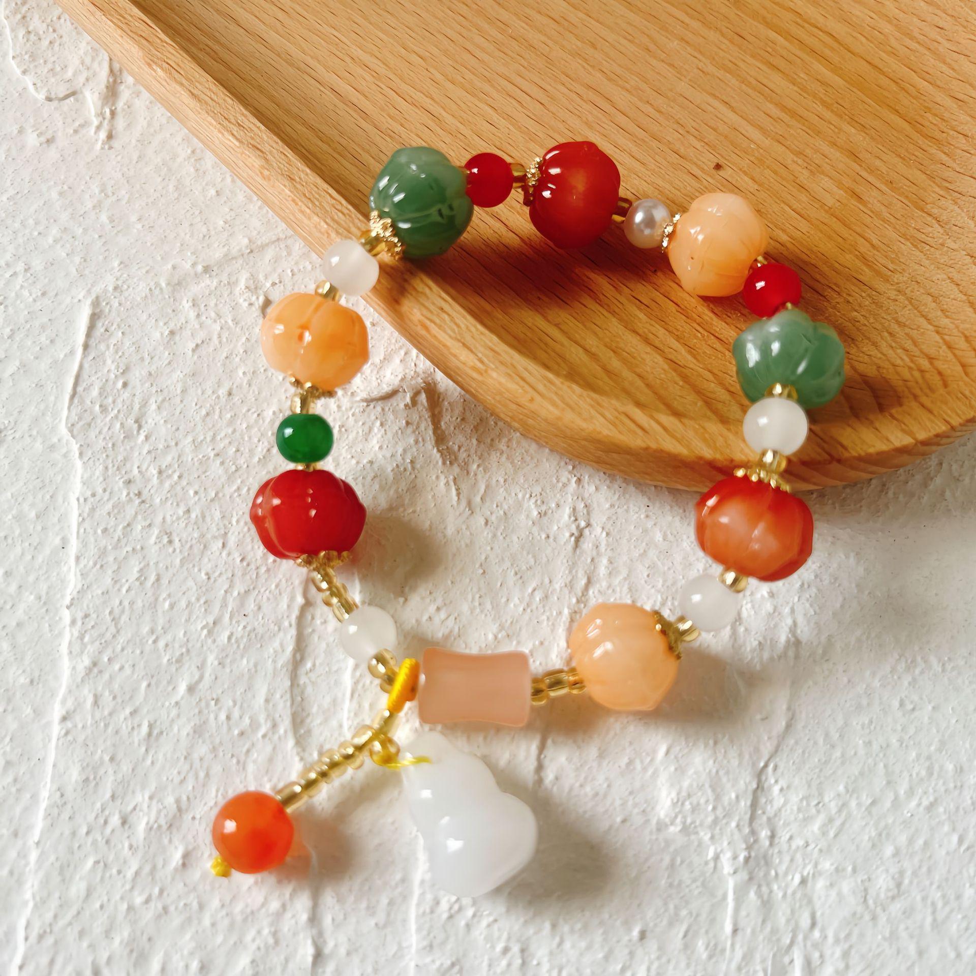 

Изысканный браслет из бусин из золотистого шелкового жадеита с кисточкой-оберегом для женщин и мужчин