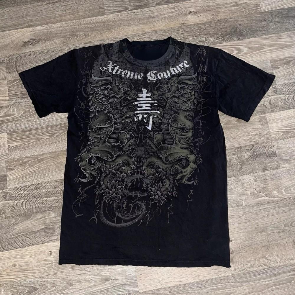 Moda estiva uomo europea e americana stampa teschio con lettere T-shirt comoda e traspirante con scollo rotondo top da esterno per strada