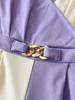 Women's Autumn Fashion Set: White Jacket with Pearl Buttons & Color Block Jumpsuit with Metal Chain Trim.