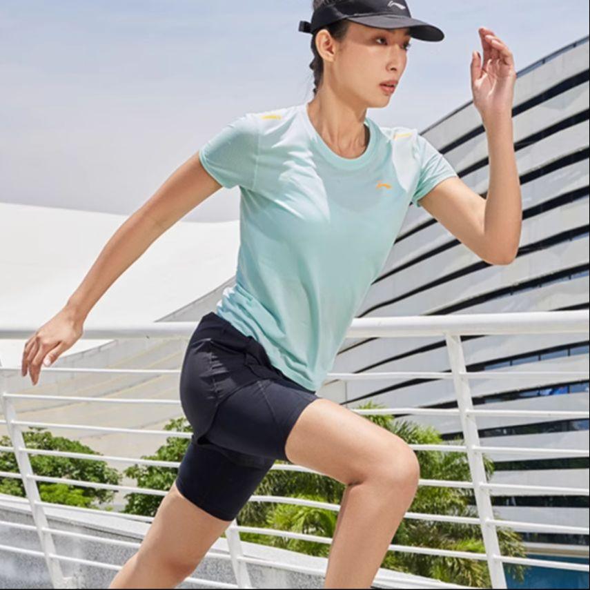 Li Ning Laufserie Einfarbige Mikroschrift Schnelltrocknend Atmungsaktiv Lauf-Trainings-Kurzarm-T-Shirt Damen Oberteile Weich-Wasserblau ATSS382-1