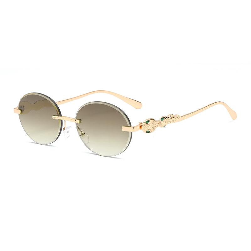 Europe and the United States gradual change frameless sunglasses oval frame fashion street shot anti-ultraviolet sunglasses retro trimmed sunshade gla