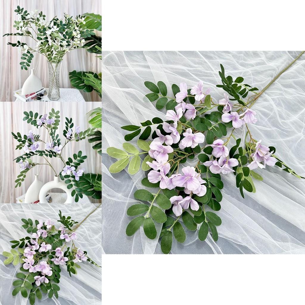 Dekorative künstliche Sophora-Pflanze für die Wohnungsdekoration und kreative Fotografieprojekte