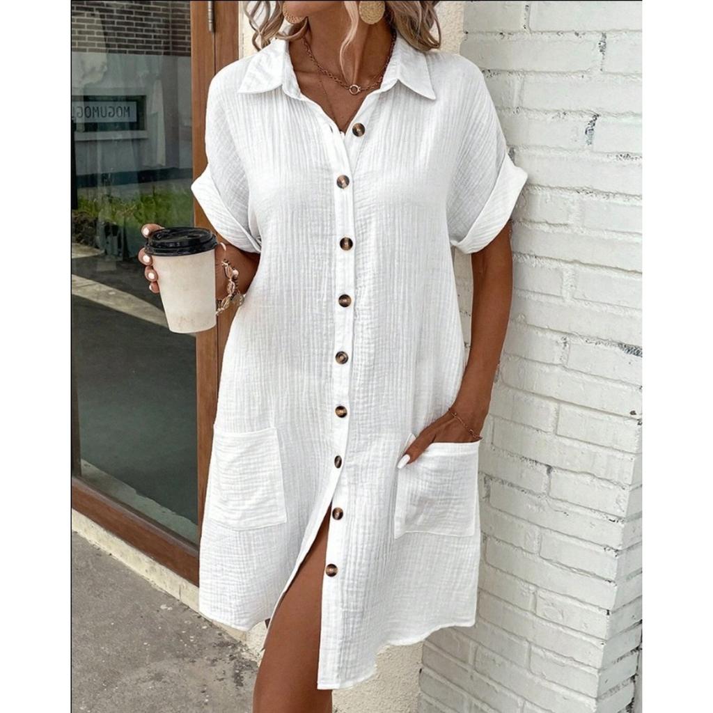 A Simple White Shirt Skirt, Made of Breathable Cotton, with A Streamlined Collar Design and Orderly Button Arrangement, Adding A Vintage Charm