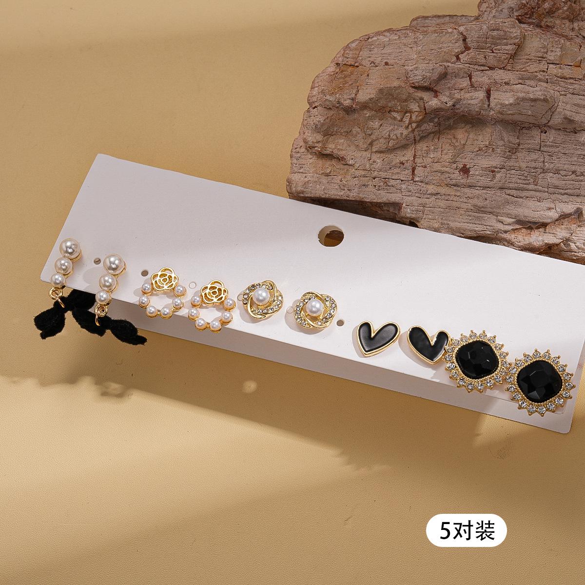 

Ten-piece set of diamond-encrusted imitation pearl flocking bow love geometric silver needle stud earrings