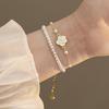 Echtgold-Galvanisierung tropfende Kamelienperle zweiteiliges Set Armband elegantes Armband Nischen-Design Schmuck Damen