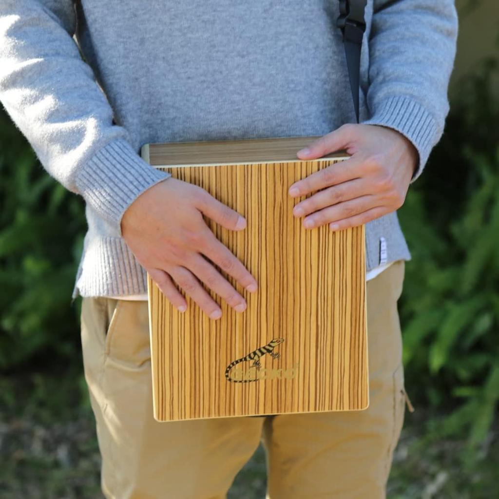 Lightweight travel cajon with built-in guitar strings and rich resonance (9.4cm x 23cm x 29cm, 1kg, engineered zebrawood)