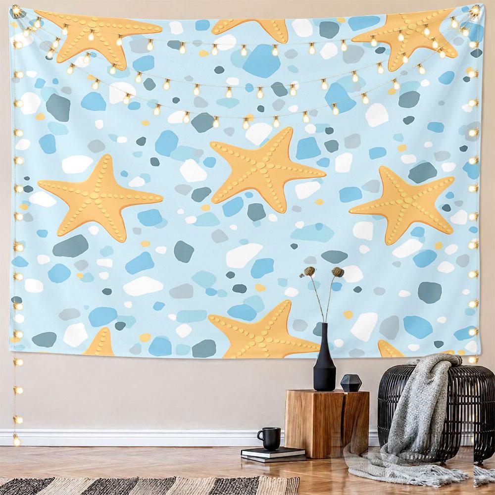 Golden starfish scattered on a blue terrazzo-style background. Patterned tapestry for bedroom and living room home decor