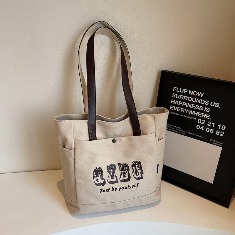 

Женская сумка-тоут 2025 новая корейская версия сумка-тоут легкая для выхода сумочка зарубежная индивидуальность большая вместимость женская сумка хаки