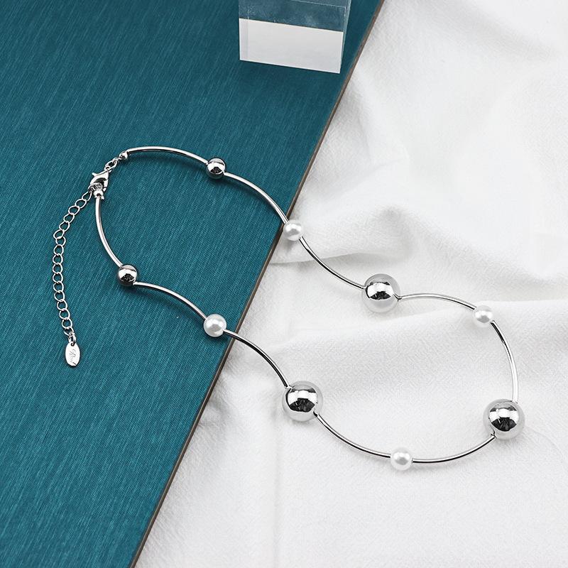

Japanese and Korean niche design large and small ball splicing metal necklace in metal wind light luxury fashion pearl collarbone chain срібний