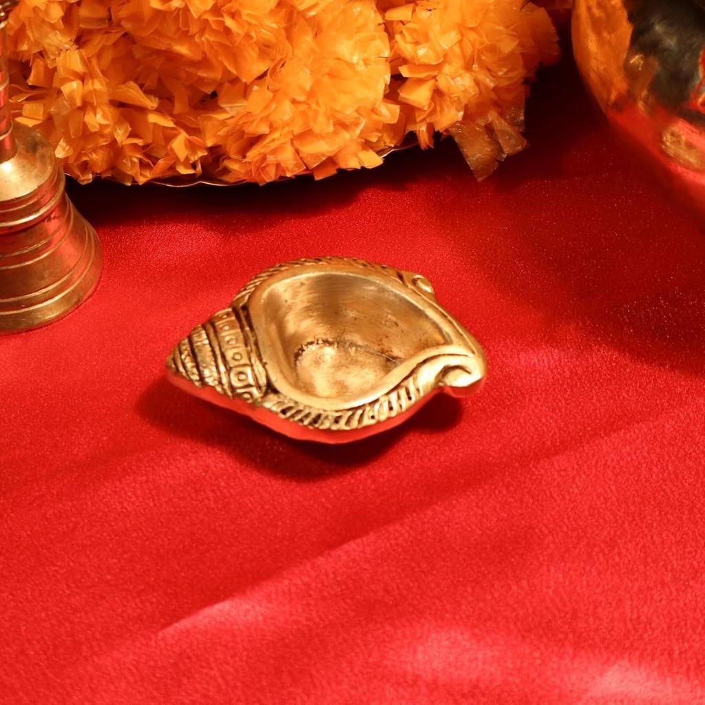 

Brass Shankh Shape Diya – 2.5 Cm | Antique Golden Finish | Handcrafted Pooja Diya