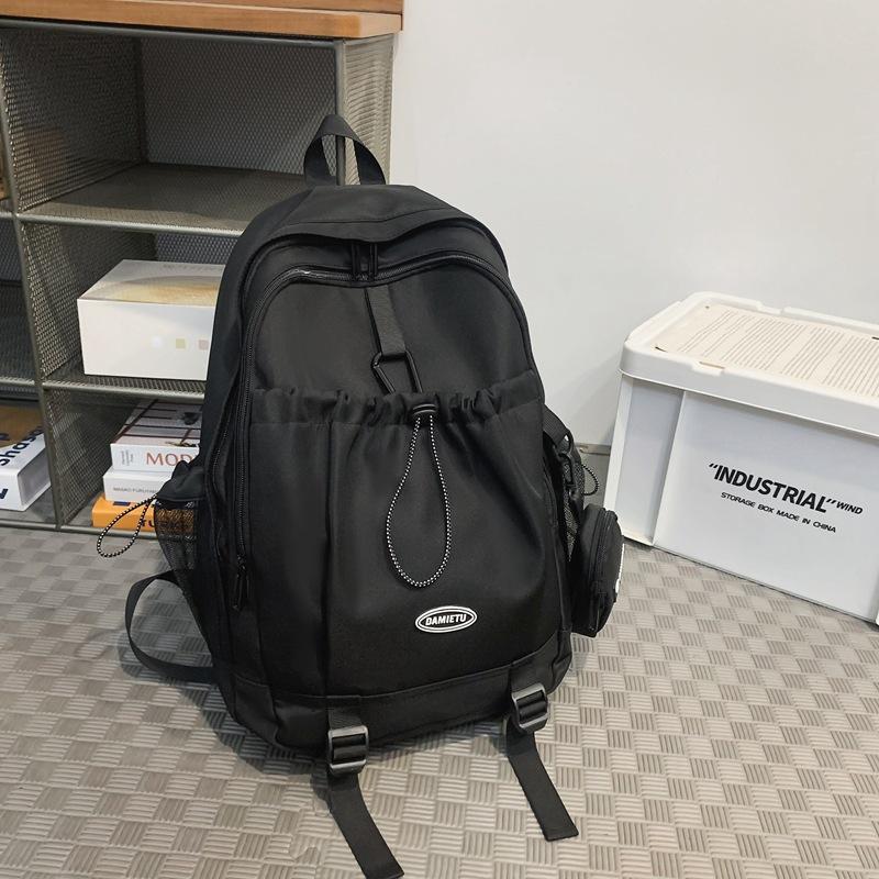 Backpack simple and fashionable college student junior high school student schoolbag female nylon large capacity leisure travel backpack male