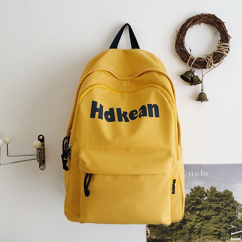 New High-value Solid Color Simple Letter Backpack Couple Casual Lightweight Large-capacity Backpack
