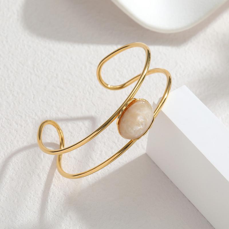 18K Gold-Inlaid Stainless Steel Hollow Line Bracelet with Stone - Elegant Fashion Jewelry for Women