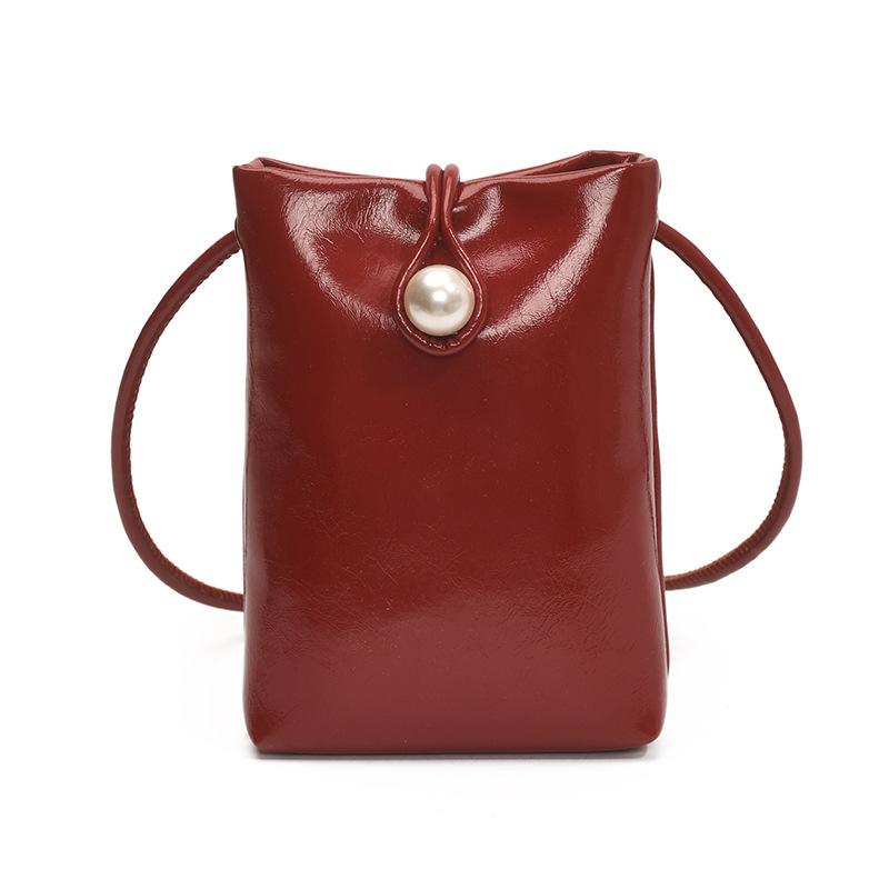 Foreign style simple key pearl buckle bucket bag French style 2025 spring and summer new shoulder messenger mobile phone bag female