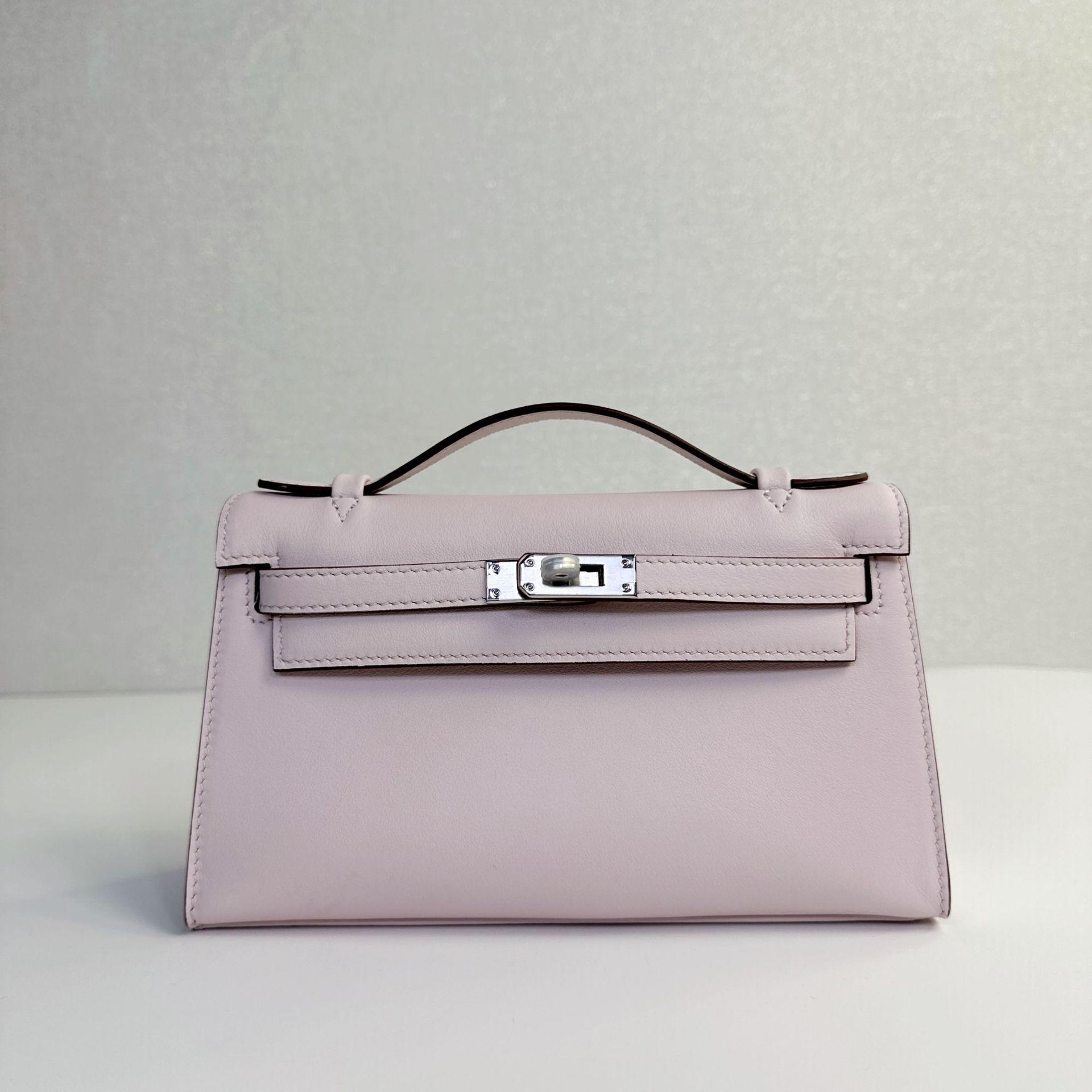 

Поколение модных сумок Верхний слой Кожа Swift Одинарная кожаная ручка Сумка-тоут Полуручная работа Натуральная кожа Сумка через плечо Мини-сумка на цепочке Женская Without Chain розовый