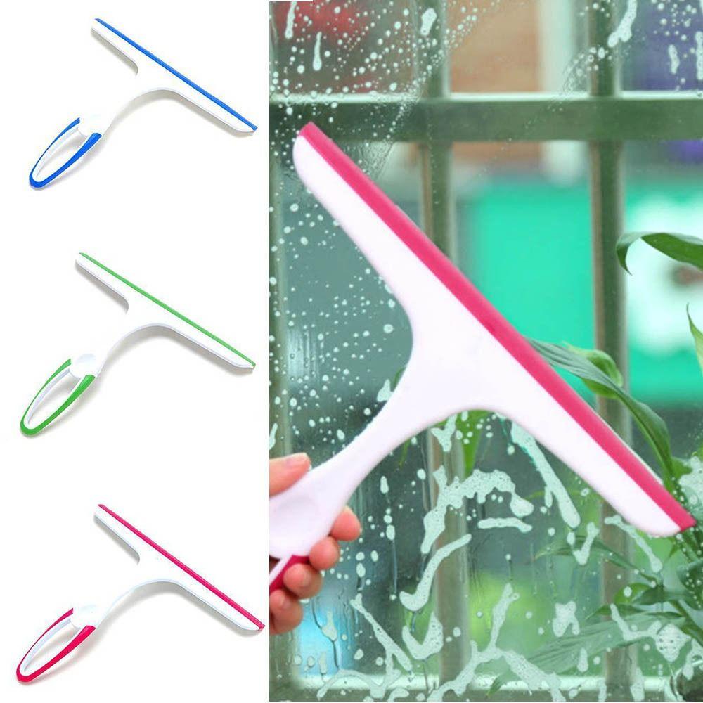 

Зеркало счищателя стекла вися на стене, скребок для окон, легкое зеркало