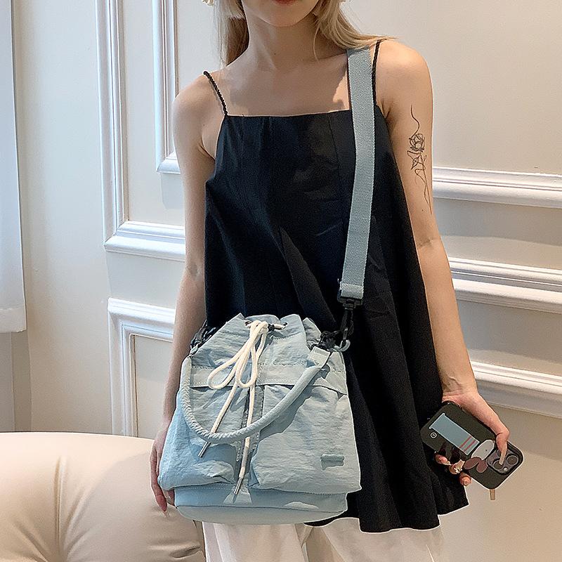 

Niche design women s small tips single shoulder messenger handbag commuter bucket bag