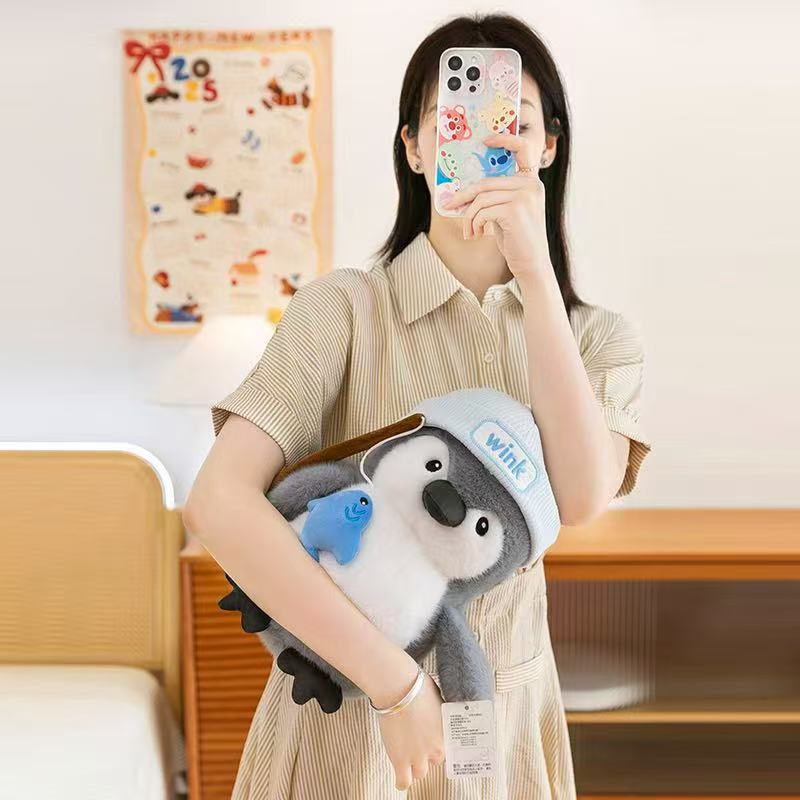 

Cute shape penguin plush toy chef painter holding fish penguin doll catching machine doll throwing gifts 22Cm