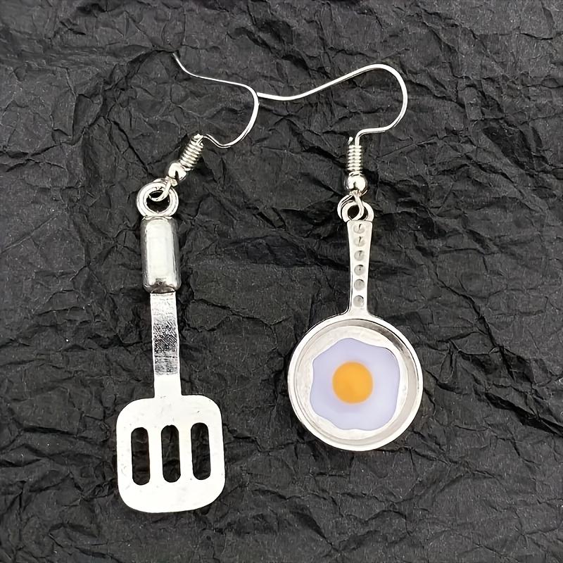 A Pair of Cute Asymmetrical Earrings Shaped Like a Frying Pan And Spatula, Perfect for Daily Wear for a with a Playful Heart