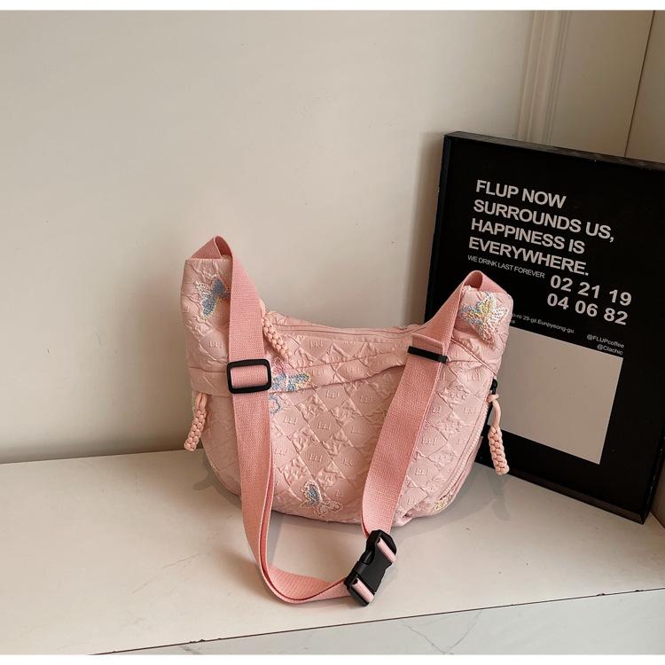 

Korean version of large-capacity canvas bag women s 2025 new commuter messenger bag sports travel cycling dumpling bag розовый