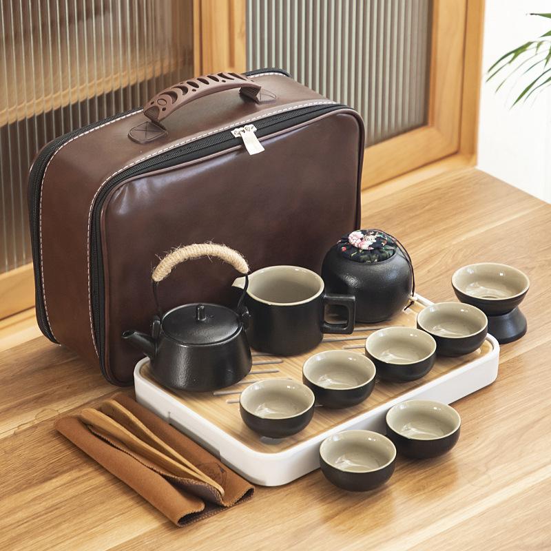 Black pottery travel kung fu tea set portable business gift set creative ceramic cooling pot set