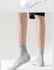 Youyuan Men's Odor-Resistant Cotton Mid-Calf Socks, Antibacterial & Breathable with Mugwort Aromatherapy, Sweat-Absorbing Solid Color.