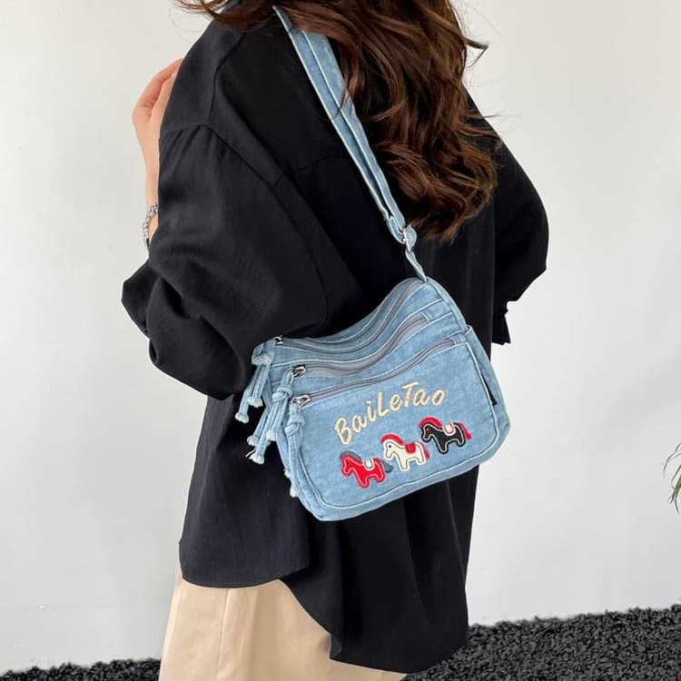 Borsa a tracolla da donna in denim con ricamo floreale