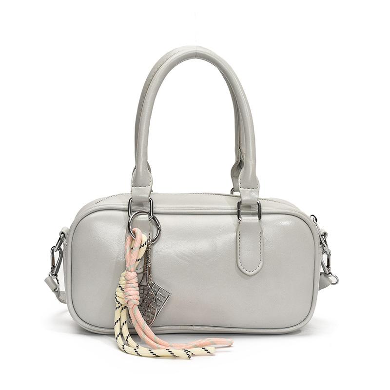 Retro commuting simple Korean version casual solid color portable bowling bag fashion high sense versatile commuting messenger bag