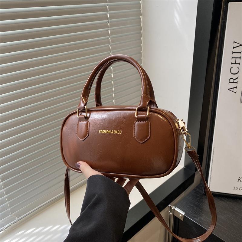 

Premium texture commuter women s bag spring and summer new portable bowling bag trendy fashion shoulder messenger bag коричневый