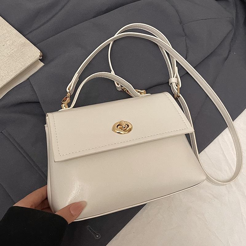 French simple high-end temperament oil wax leather portable small square bag women's commuting versatile solid color casual style messenger bag