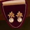Golden flower French elegance temperament niche design sense natural freshwater Edison wrinkled pearl stud earrings