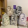 Mochila escolar pequena e fresca com estampa literária e artística, nova para a primavera, para uso diário e deslocamento, mochila de ombro