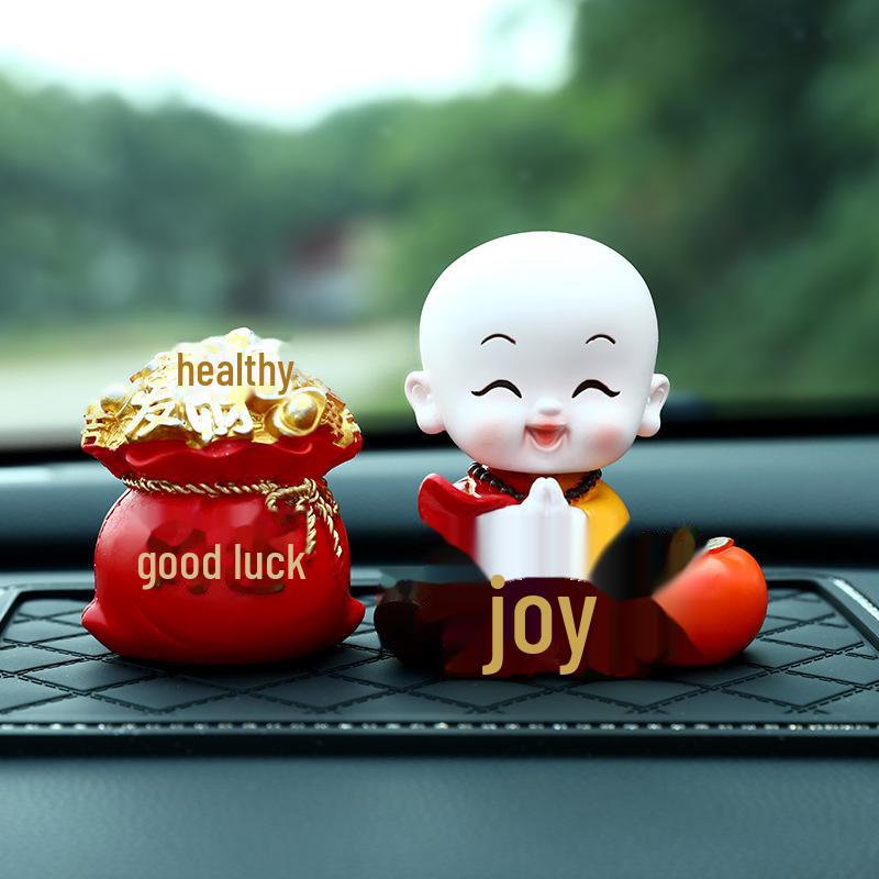 Creative Little Monk Maitreya Buddha Car Ornament: Cute, Shaking Head Resin Doll for Car Interior Decoration and Safety.