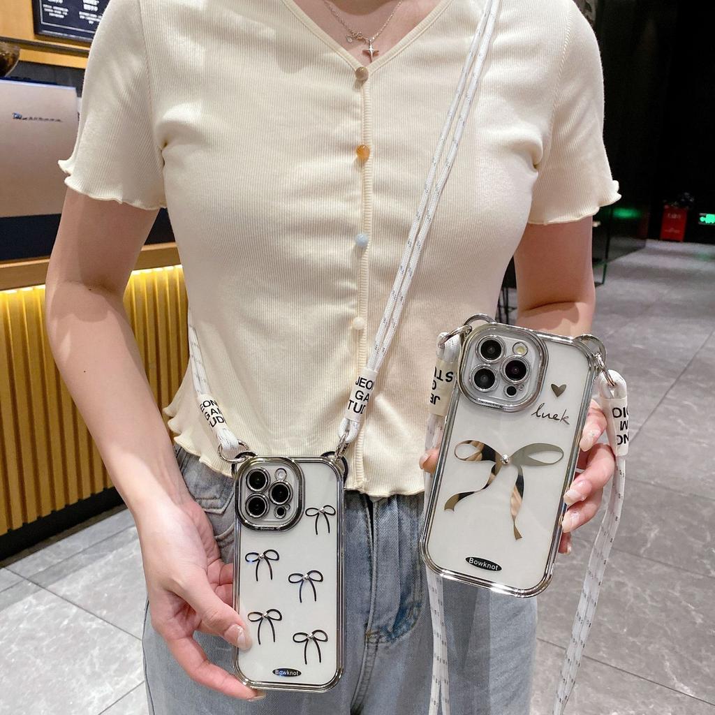 The Bow Tie Crossbody Lanyard Is Suitable for IPhone15promax Phone Cases. It Features A Simple Apple 14 Electroplated Anti-drop Soft Case