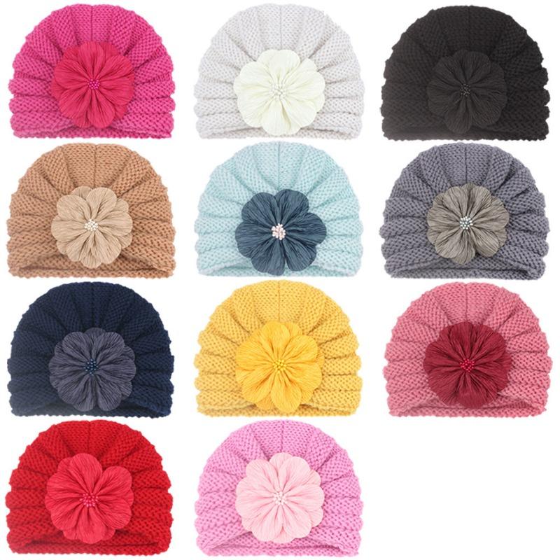 

New children s autumn and winter warm knitted hat, baby fashion match flower pullover hat