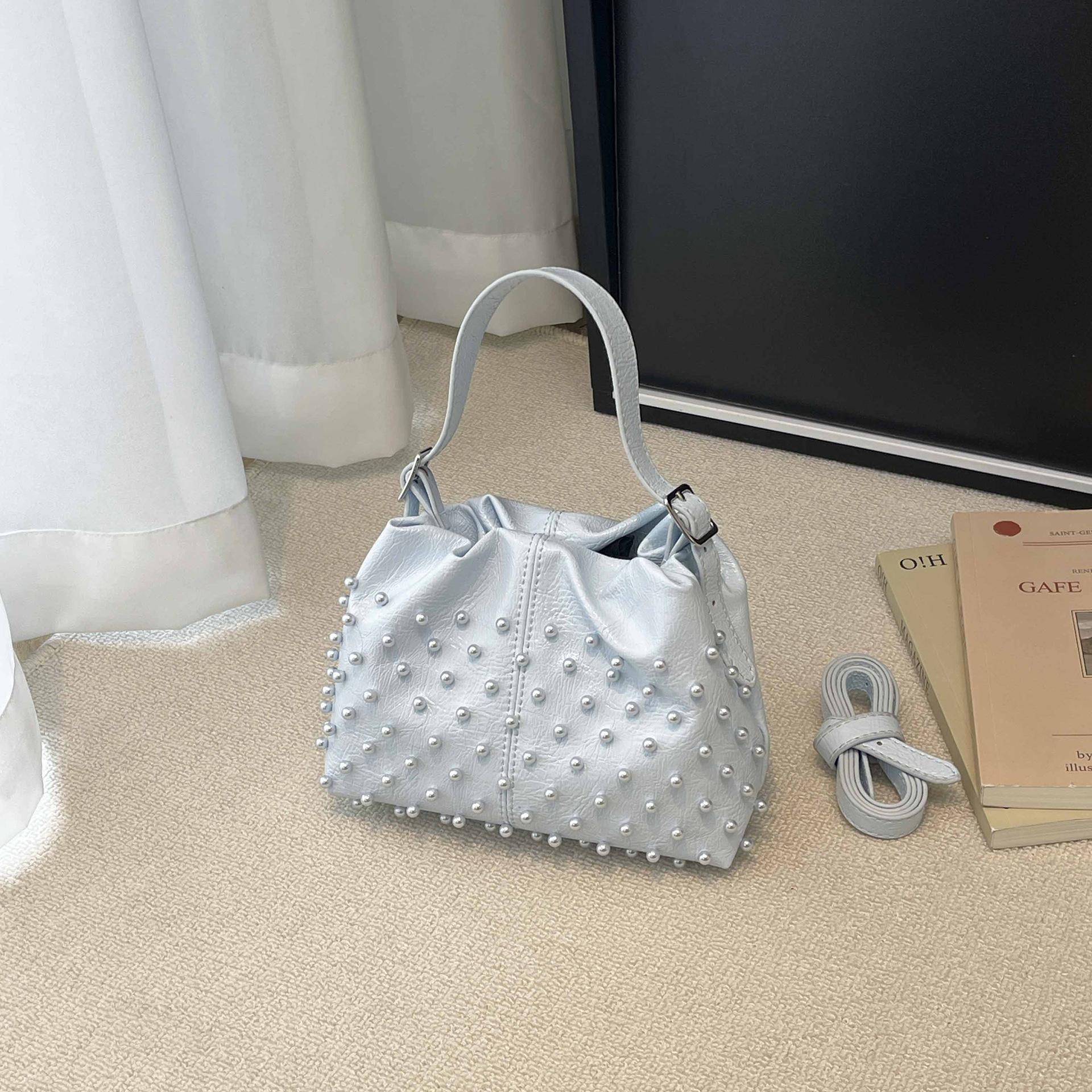 

Trend European and American fashion rivets spring and summer armpit women s bags simple and versatile portable bucket bags single shoulder oblique spa синій
