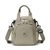 Kompakt Nylon Crossbody Miniryggsäck med Topphandtag Casual Liten Dagryggsäcksväska för Kvinnor Daglig Resa